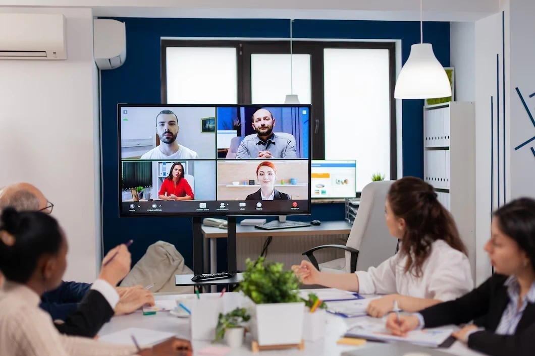 Team attending hybrid meeting with remote participants