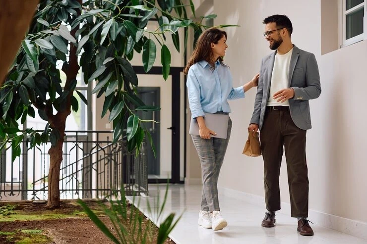 Event planner consulting with client in lobby